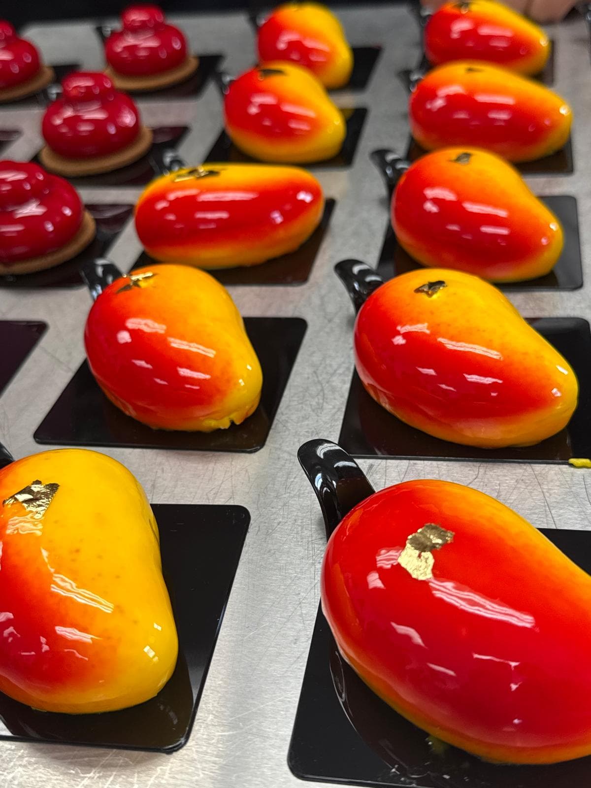 Glazed mango-shaped desserts